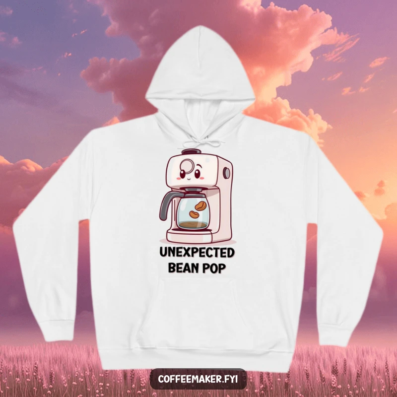 Funny hoodie with a surprised coffee maker machine looking shocked as a small coffee bean jumps out, symbolizing unexpected fun.